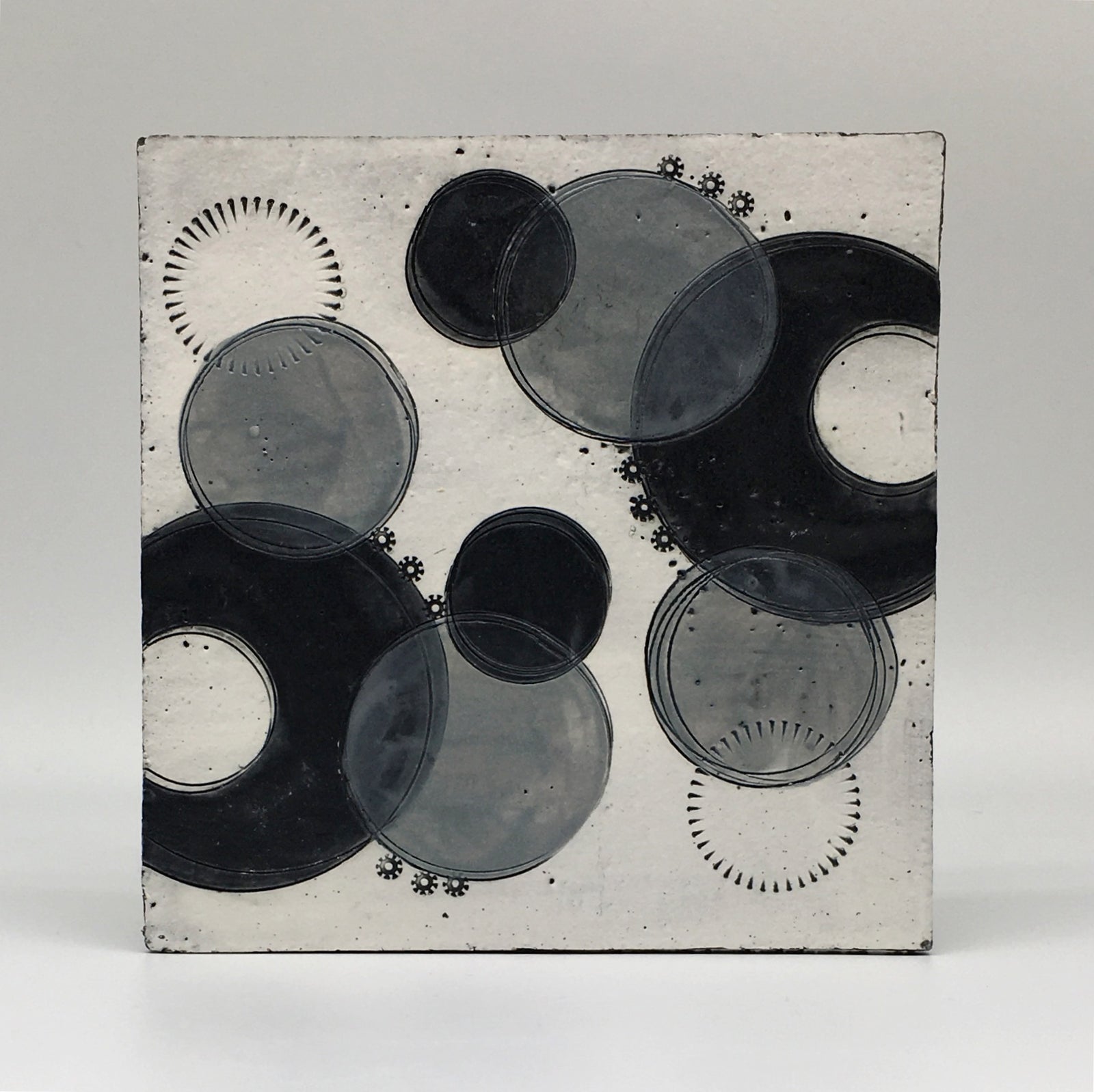 Small wall plaque - black crescents and grey spots