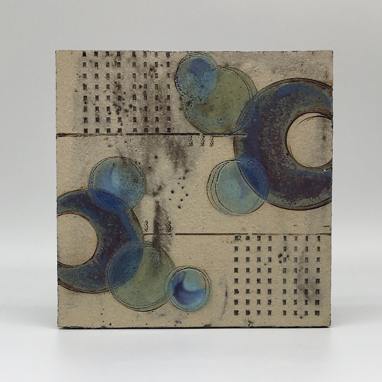 Small wall plaque - muted colours with bold purple circles and double lines